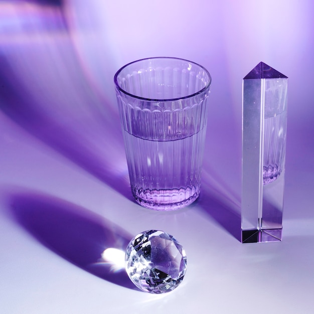 Soft light falling across a shelf of crystal glassware