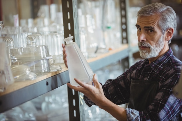 A technician reviewing a crystal glass near natural light